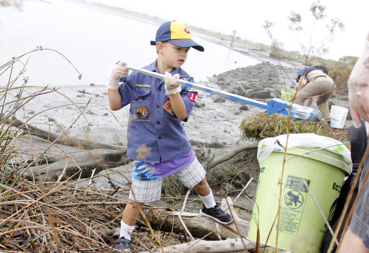 Scout picking up trash